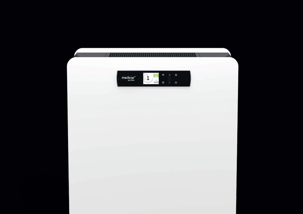 Upper half of the white MedicAir Pro Max air purifier with its control panel and colour display on a black background